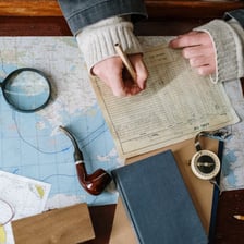 An open logbook on a ship’s desk