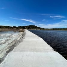 A dam holding back water in a river.