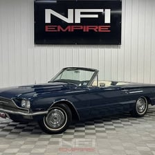 A classic Ford Thunderbird convertible automobile.