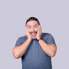 A surprised person reacting with raised eyebrows