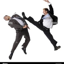 Two people engaged in a fight.