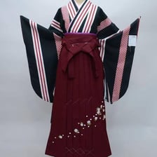 A Japanese furisode kimono fastened with a wide obi sash.