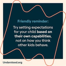 A parent quietly reminds a child to behave.