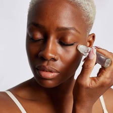Eye cream being applied beneath the eye.