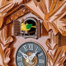 A cuckoo clock with its small bird door open