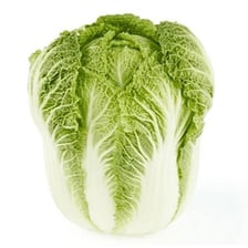 A whole pale-green napa cabbage.