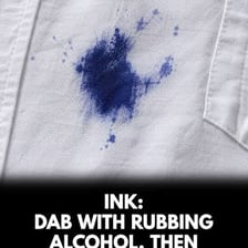 A person gently dabbing a stain with a cloth