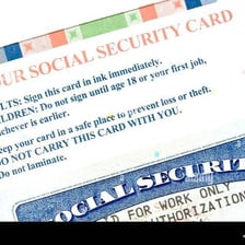 A United States Social Security card with identifying information obscured.