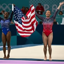 Simone Biles performing a gymnastics routine