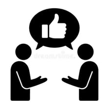 Two people in conversation, with one signaling agreement.