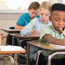 A student taking a written exam