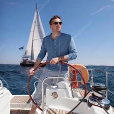 A person steering a boat