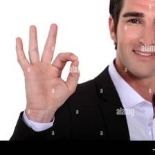 A person making an OK hand gesture.
