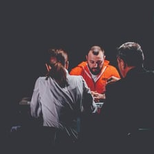 An interviewer drawing an answer from a person during a conversation.