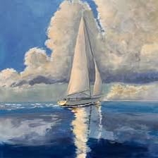A sailboat traveling across calm, smooth water.