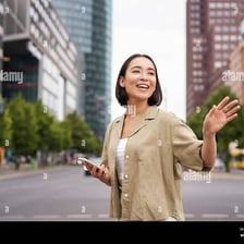 A person waving hello to someone at a distance.