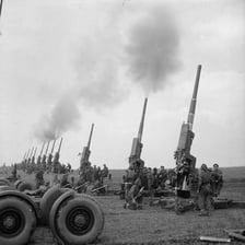 Artillery firing in a burst of shots.