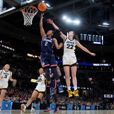A women’s college basketball game played under NCAA competition