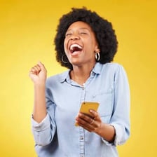 An enthusiastic person celebrating with raised arms