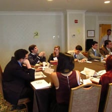 A small committee meeting around a table.