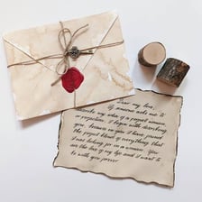 A handwritten romantic letter beside its envelope.