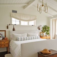 A simply furnished room has plain walls and no decorative extras.