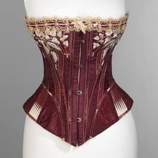 A historical women’s supportive garment displayed in a museum setting.