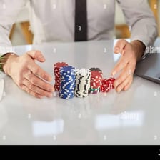 Person celebrating a run of wins beside casino chips