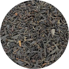 Loose black tea leaves labeled orange pekoe.