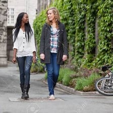 People speaking casually on a city street