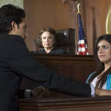 A defense witness testifying in a courtroom.