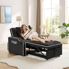 A sleeper sofa opened into a bed in a living room.