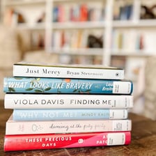 A stack of books identified as memoirs.
