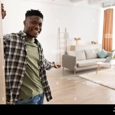 Person gesturing toward a doorway to indicate that someone should leave