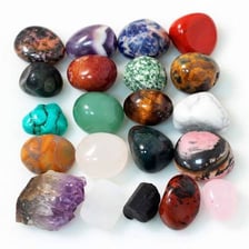 An assortment of colorful polished gemstones