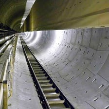 A large underground sewer tunnel used to carry wastewater.