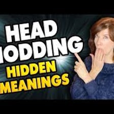 A person nodding to show understanding during a conversation.