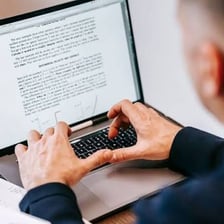 A person rapidly typing to finish a document