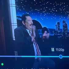 A television viewer watching a program during an advertising break.
