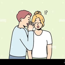 One person whispering information to another in a secretive conversation.