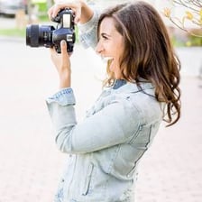 A relaxed person smiling naturally in a candid portrait