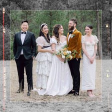 Groom standing alongside members of a wedding party