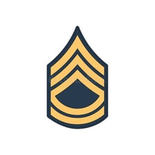 A military sergeant wearing noncommissioned-officer insignia.