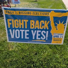 Campaign signs representing opposing sides of a referendum