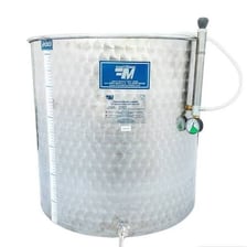A large tank used to hold fermenting wine at a winery.