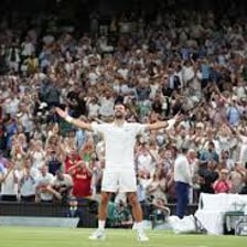 A tennis player celebrating after winning a match.