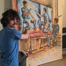 An artist demonstrating a natural talent by painting.