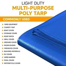 A tarp covering equipment outdoors.