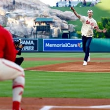 A professional baseball pitcher delivering a pitch.