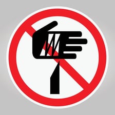 A raised hand signaling someone not to proceed.